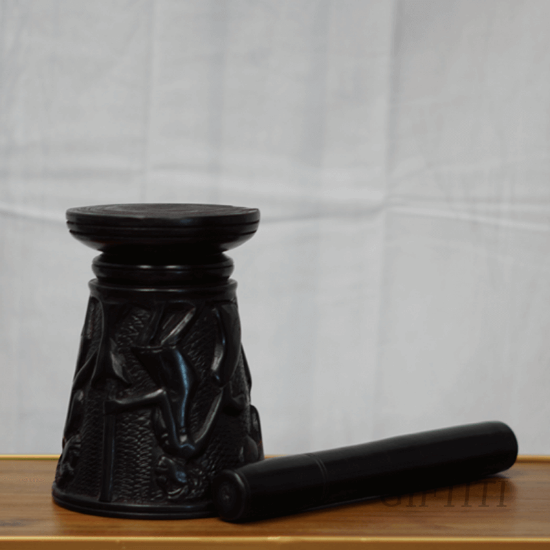 Picture of Antique wooden mortar and pestle with embossed scriptures