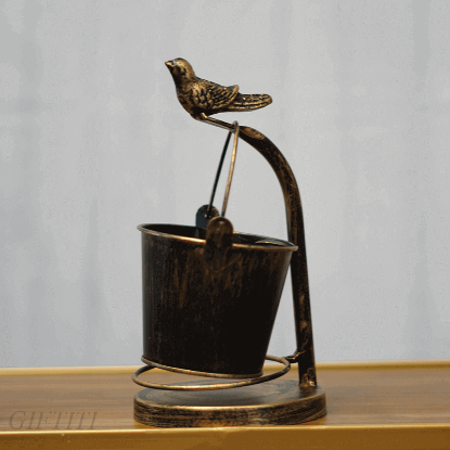 Picture of Gold Sparrow Watches Over A Bucket